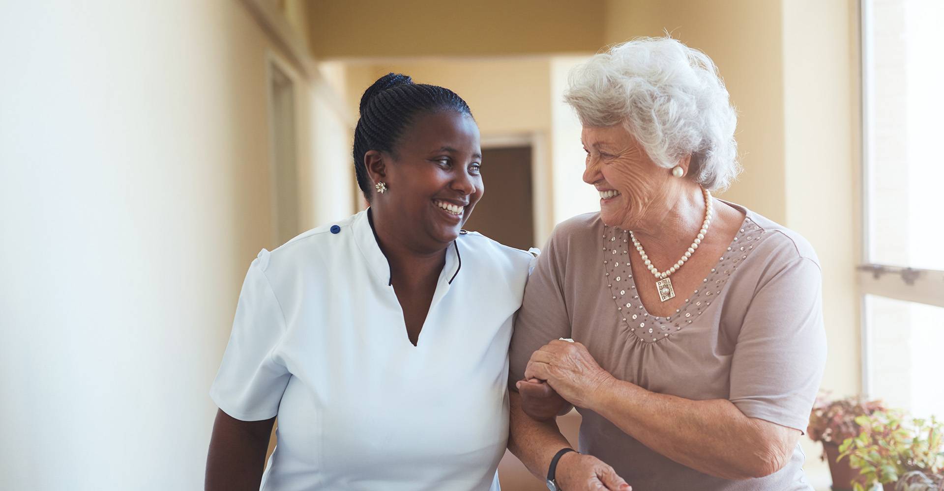 Health-care professional with elderly patient